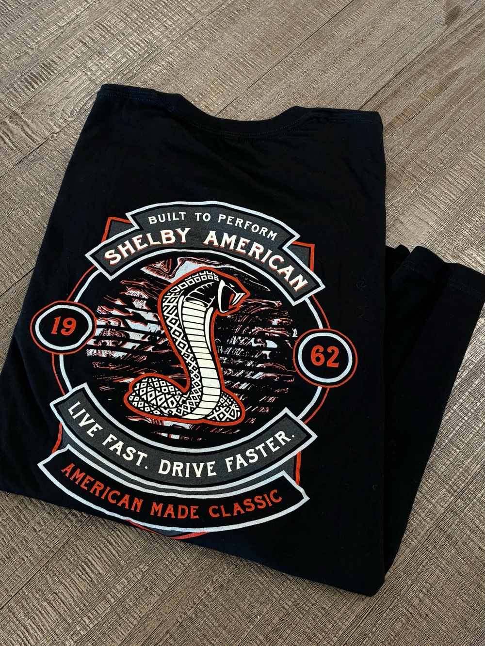 Selby Black Tee with Orange and White Cobra Graphic